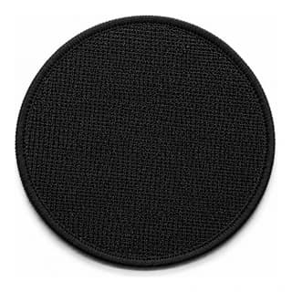 Envers d'un écusson rond équipé d'un velcro mâle noir, crochets visibles sur toute la surface